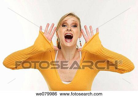 Blond woman screaming in the studio View Large Photo Image Stock Photograph - Blond woman screaming in the studio. Fotosearch