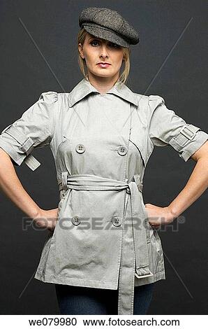 Blond woman with hat posing in the studio View Large Photo Image Stock Image - Blond woman with hat posing in the studio. Fotosearch