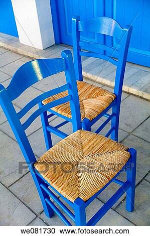 Blue chairs in the street, Cyclades islands, Greece View Large Photo Image Stock Image - Blue chairs in the street, Cyclades islands, Greece. Fotosearch