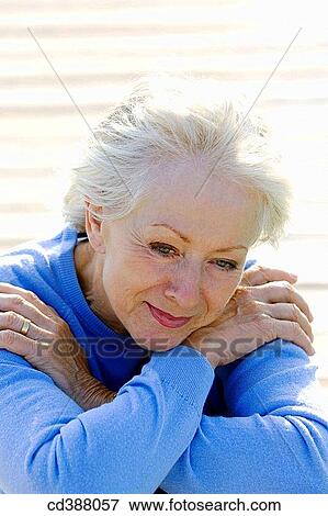 Stock Photo - blue eyes, contemporary, absorbed. Fotosearch