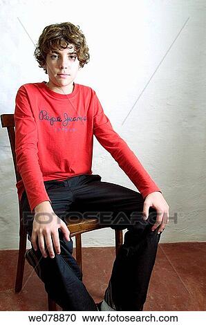 Stock Image - boy, chair, brown hair, adolescence. Fotosearch