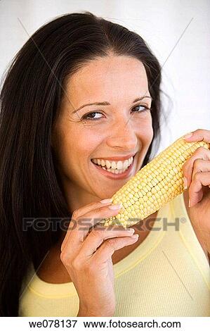 Stock Photo - brunette, cereals, cob. Fotosearch