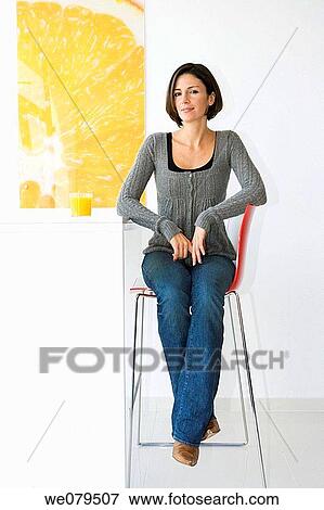 brunette, chair, at-home View Large Photo Image Stock Photo - brunette, chair, at-home. Fotosearch