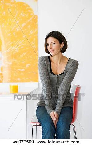 brunette, chair, at-home View Large Photo Image Stock Photo - brunette, chair, at-home. Fotosearch