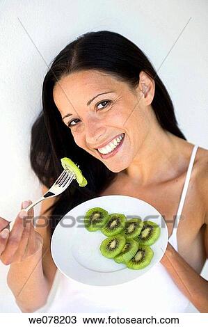Stock Image - brunette, Chinese Gooseberry, contemporary. Fotosearch