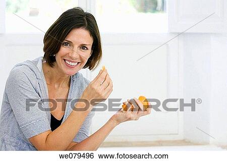 brunette, Citrus fruit, at-home View Large Photo Image Stock Photograph - brunette, Citrus fruit, at-home. Fotosearch