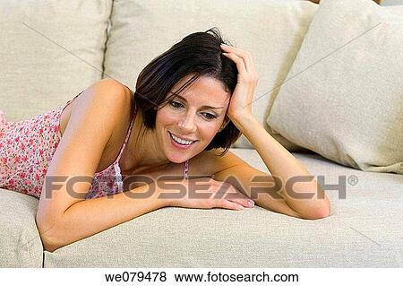 Stock Photo - brunette, comfort, at-home. Fotosearch