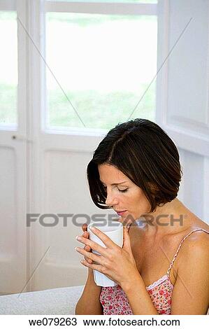 brunette, contemporary, at-home View Large Photo Image Stock Image - brunette, contemporary, at-home. Fotosearch