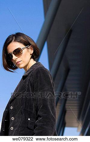 Stock Image - brunette, contemporary, dark hair. Fotosearch