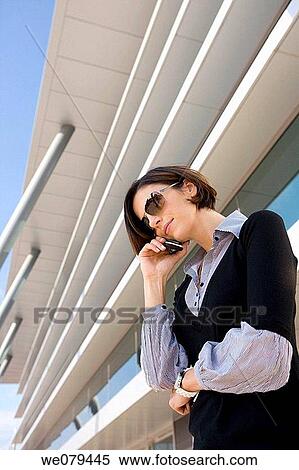 Stock Photography - building, business, businesspeople, businesswoman, calling. Fotosearch