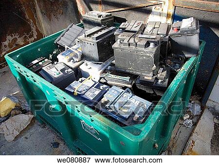 Car batteries in green recycling container View Large Photo Image Stock Photo - Car batteries in green recycling container. Fotosearch