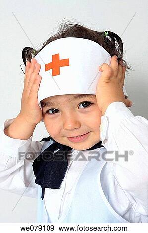 Stock Photo - child, amusing, cap, brunette, baby, 3-4 years. Fotosearch