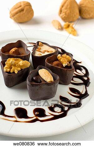 Chocolates with nuts View Large Photo Image Stock Photograph - Chocolates with nuts. Fotosearch