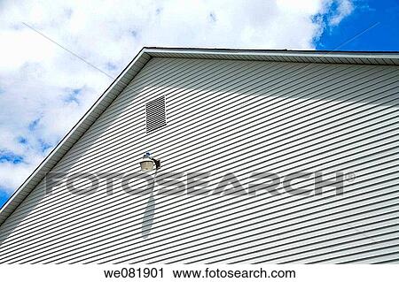 Close-up showing the side of a building with an attached light. View Large Photo Image Stock Image - Close-up showing the side of a building with an attached light.. Fotosearch