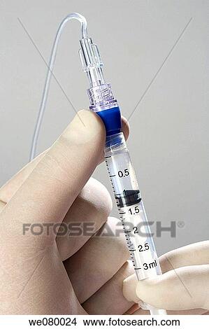 Doctors hands manipulating needles View Large Photo Image Picture - Doctors hands manipulating needles. Fotosearch