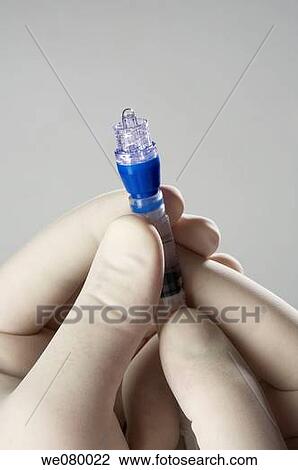Doctors hands manipulating needles View Large Photo Image Stock Image - Doctors hands manipulating needles. Fotosearch