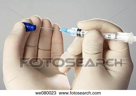Doctors hands manipulating needles View Large Photo Image Stock Image - Doctors hands manipulating needles. Fotosearch