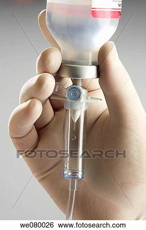 Stock Photograph - Doctors hands manipulating needles. Fotosearch
