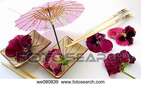 Edible pansies, chopsticks and little umbrella View Large Photo Image Stock Photo - Edible pansies, chopsticks and little umbrella. Fotosearch