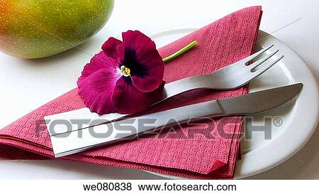 Edible pansy and cutlery View Large Photo Image Stock Photo - Edible pansy and cutlery. Fotosearch