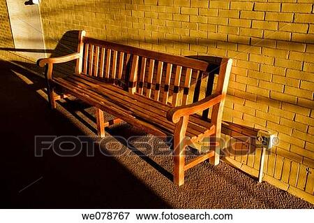 Empty bench in an office building being lit by the sun. View Large Photo Image Stock Photo - Empty bench in an office building being lit by the sun.. Fotosearch