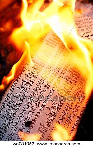 Stock Photo - Financial business newspaper on fire. Fotosearch