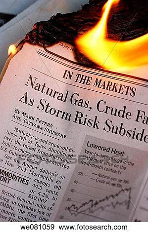Stock Photo - Financial business newspaper on fire. Fotosearch