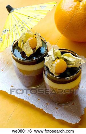 Four chocolates dessert with Cape gooseberry fruits View Large Photo Image Stock Photograph - Four chocolates dessert with Cape gooseberry fruits. Fotosearch