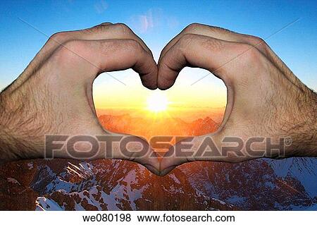 German and Austrian Alps, view from the Zugspitze, highest peak in Germany, hands shaping a heart formed window, winter, Bayern, Germany View Large Photo Image Stock Photo - German and Austrian Alps, view from the Zugspitze, highest peak in Germany, hands shaping a heart formed window, winter, Bayern, Germany. Fotosearch