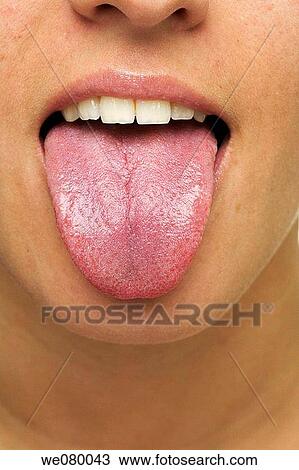 Stock Image - Girl sticking her tongue out. Fotosearch