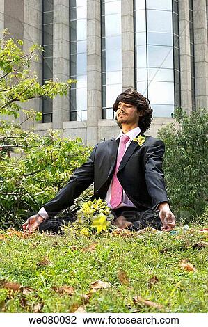 Groom doing Yoga on the grass before ceremony View Large Photo Image Stock Image - Groom doing Yoga on the grass before ceremony. Fotosearch