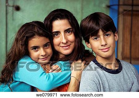 Latin American Family posing for the camera. Mother with son and daughter View Large Photo Image Stock Image - Latin American Family posing for the camera. Mother with son and daughter. Fotosearch