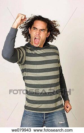 Latin model in his 30s celebrating with a fist pump View Large Photo Image Stock Image - Latin model in his 30s celebrating with a fist pump. Fotosearch