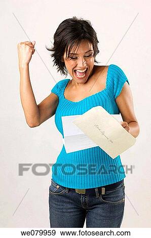 Latin model in his 30s celebrating with a fist pump the arrival of a letter View Large Photo Image Stock Photo - Latin model in his 30s celebrating with a fist pump the arrival of a letter. Fotosearch