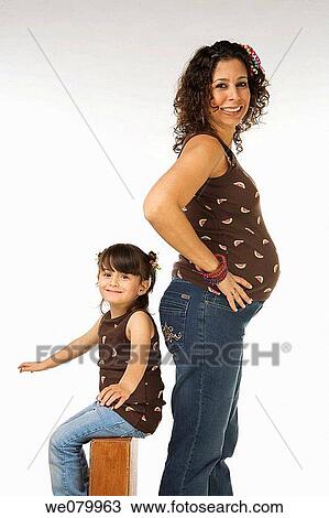 Latin pregnant woman and child posing in the studio View Large Photo Image Stock Image - Latin pregnant woman and child posing in the studio. Fotosearch
