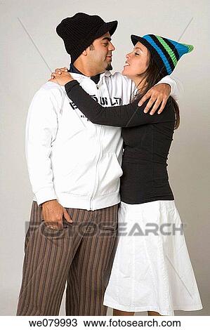 Latin young couple looking at each other View Large Photo Image Stock Image - Latin young couple looking at each other. Fotosearch