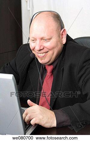 Middle-age man in his office View Large Photo Image Stock Image - Middle-age man in his office. Fotosearch