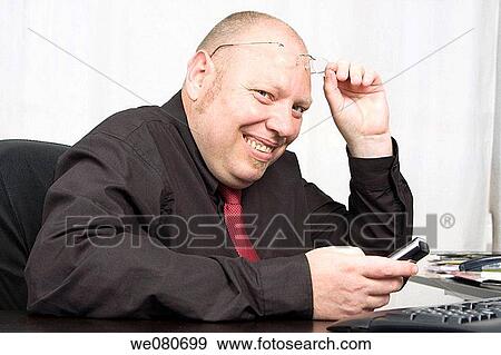 Middle-age man using cell phone View Large Photo Image Stock Photo - Middle-age man using cell phone. Fotosearch