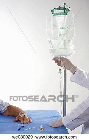 Old man's hands being fed saline solution View Large Photo Image Stock Photo - Old man's hands being fed saline solution. Fotosearch