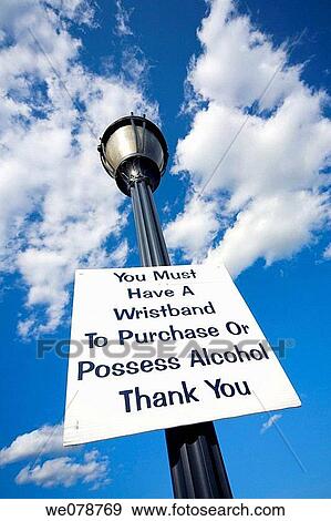 Posted sign at an event reading,? You Must Have A Wristband To Purchase Alcohol?. View Large Photo Image Stock Photo - Posted sign at an event reading,? You Must Have A Wristband To Purchase Alcohol?.. Fotosearch