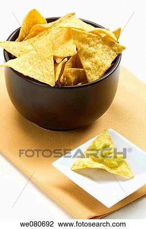 Tortilla chips and guacamole View Large Photo Image Stock Image - Tortilla chips and guacamole. Fotosearch