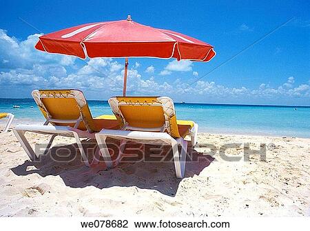 Umbrella and deckchairs on beach, Isla Mujeres, Cancun. Yucatan, Mexico View Large Photo Image Stock Image - Umbrella and deckchairs on beach, Isla Mujeres, Cancun. Yucatan, Mexico. Fotosearch