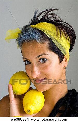 Woman with lemons View Large Photo Image Picture - Woman with lemons. Fotosearch