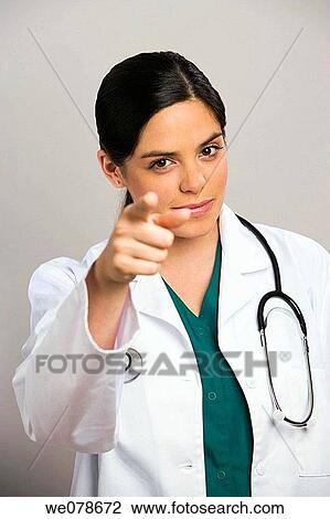 Young female doctor wearing stethoscope, portrait View Large Photo Image Stock Image - Young female doctor wearing stethoscope, portrait. Fotosearch