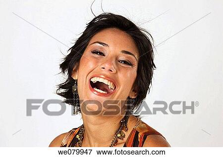 Young Latin model in her 20s smiling at the camera View Large Photo Image Stock Photo - Young Latin model in her 20s smiling at the camera. Fotosearch