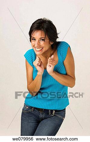 Young Latin model in her 20s smiling at the camera in a studio setting View Large Photo Image Stock Photograph - Young Latin model in her 20s smiling at the camera in a studio setting. Fotosearch