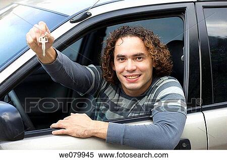 Young man shows the key to his new car View Large Photo Image Stock Photography - Young man shows the key to his new car. Fotosearch