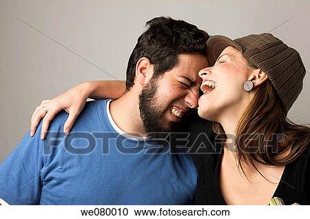 Young trendy couple smiling View Large Photo Image Stock Image - Young trendy couple smiling. Fotosearch