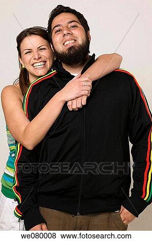 Young trendy couple smiling View Large Photo Image Stock Photo - Young trendy couple smiling. Fotosearch