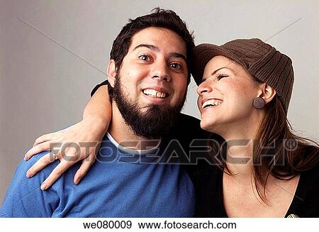 Young trendy couple smiling View Large Photo Image Stock Photo - Young trendy couple smiling. Fotosearch